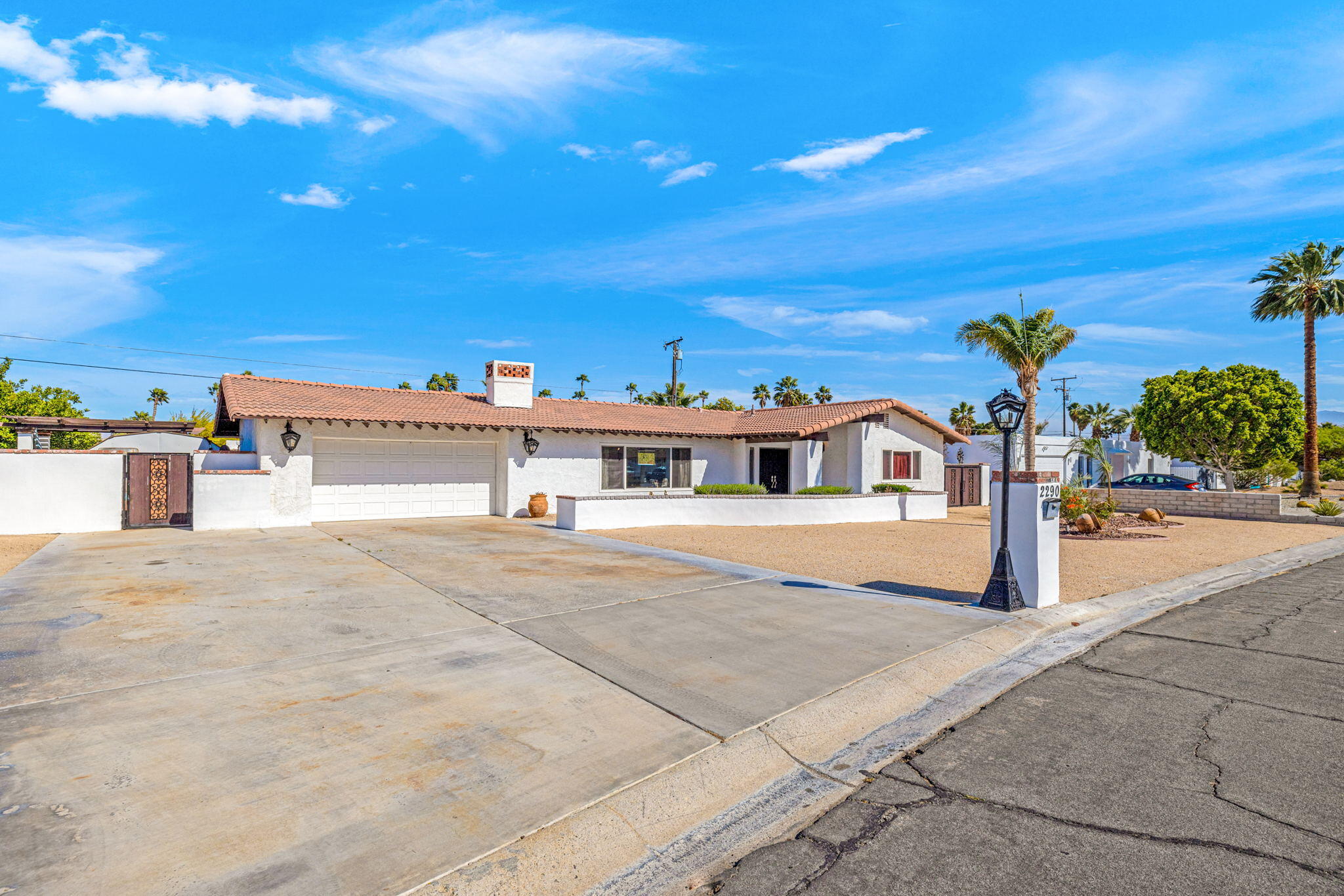 2290 North Victoria Road Palm Springs, CA 92262 - Photo 7 of 42 a front view of a building with sign board