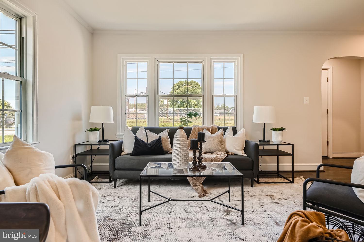 8517 Philadelphia Road Rosedale, MD 21237 - Photo 3 of 27 a living room with furniture and large windows