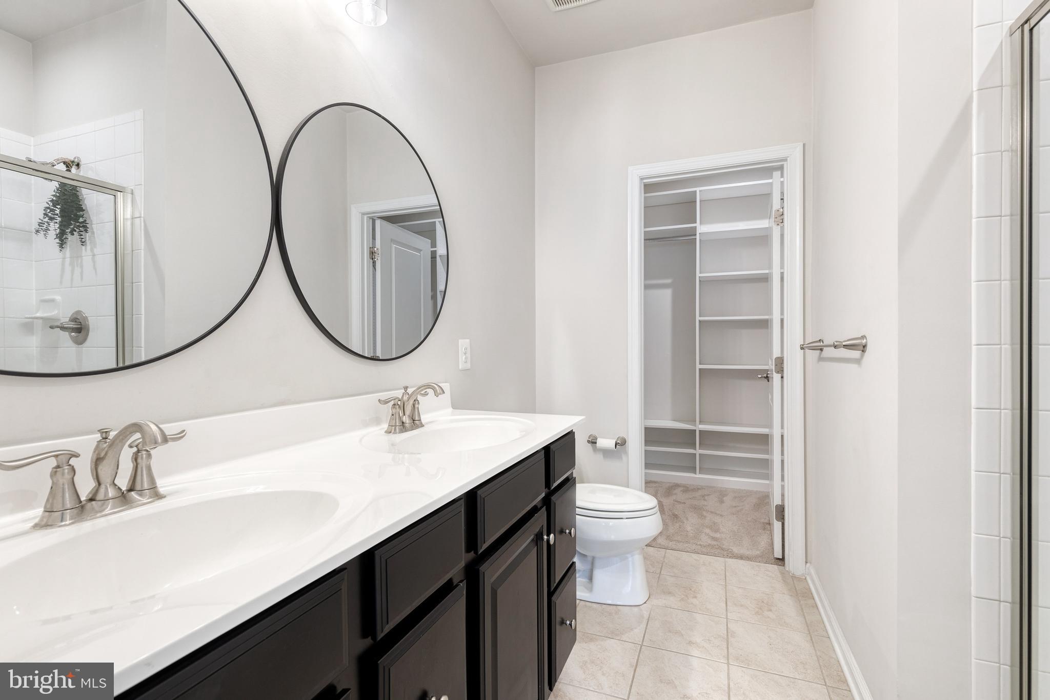 1438 Strahorn Road Hanover, MD 21076 - Photo 12 of 19 a bathroom with a sink and a mirror