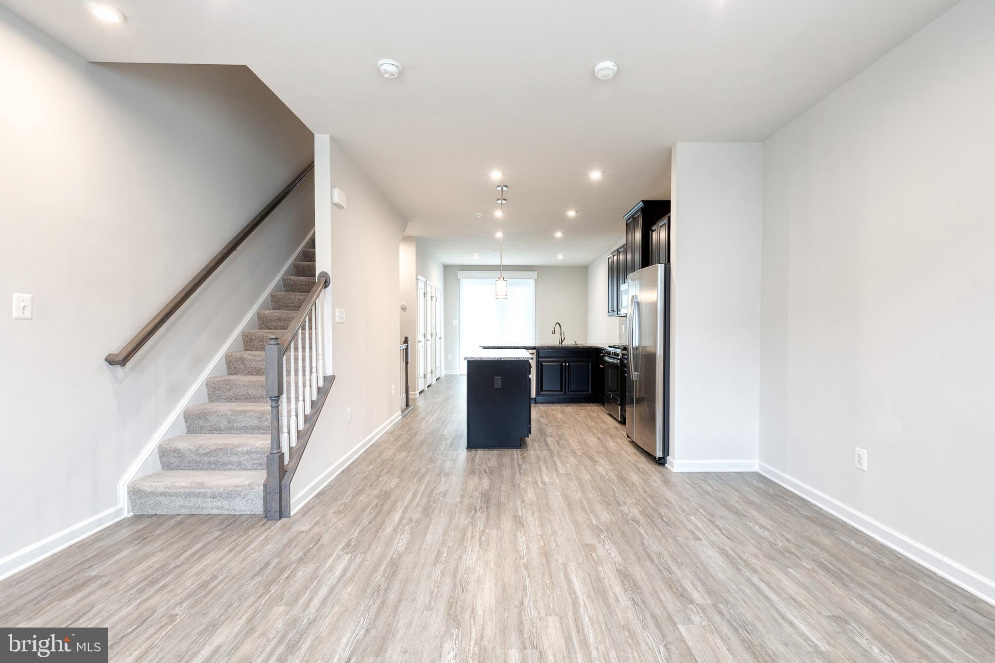 1438 Strahorn Road Hanover, MD 21076 - Photo 2 of 19 a view of a kitchen with wooden floor and electronic appliances