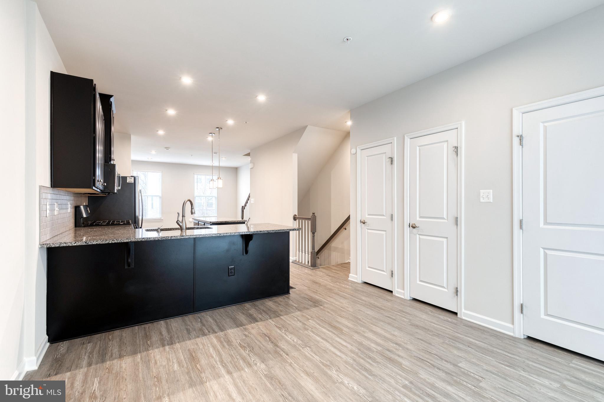 1438 Strahorn Road Hanover, MD 21076 - Photo 7 of 19 a view of kitchen with wooden floor