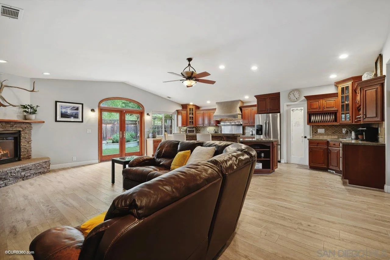 9541 Mandeville Road Santee, CA 92071 - Photo 14 of 32 a living room with furniture kitchen and a wooden floor