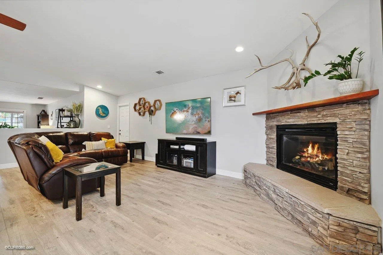 9541 Mandeville Road Santee, CA 92071 - Photo 16 of 32 a living room with furniture and a fireplace