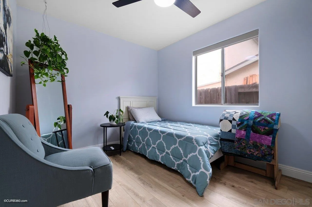 9541 Mandeville Road Santee, CA 92071 - Photo 17 of 32 a bedroom with a bed window and couch