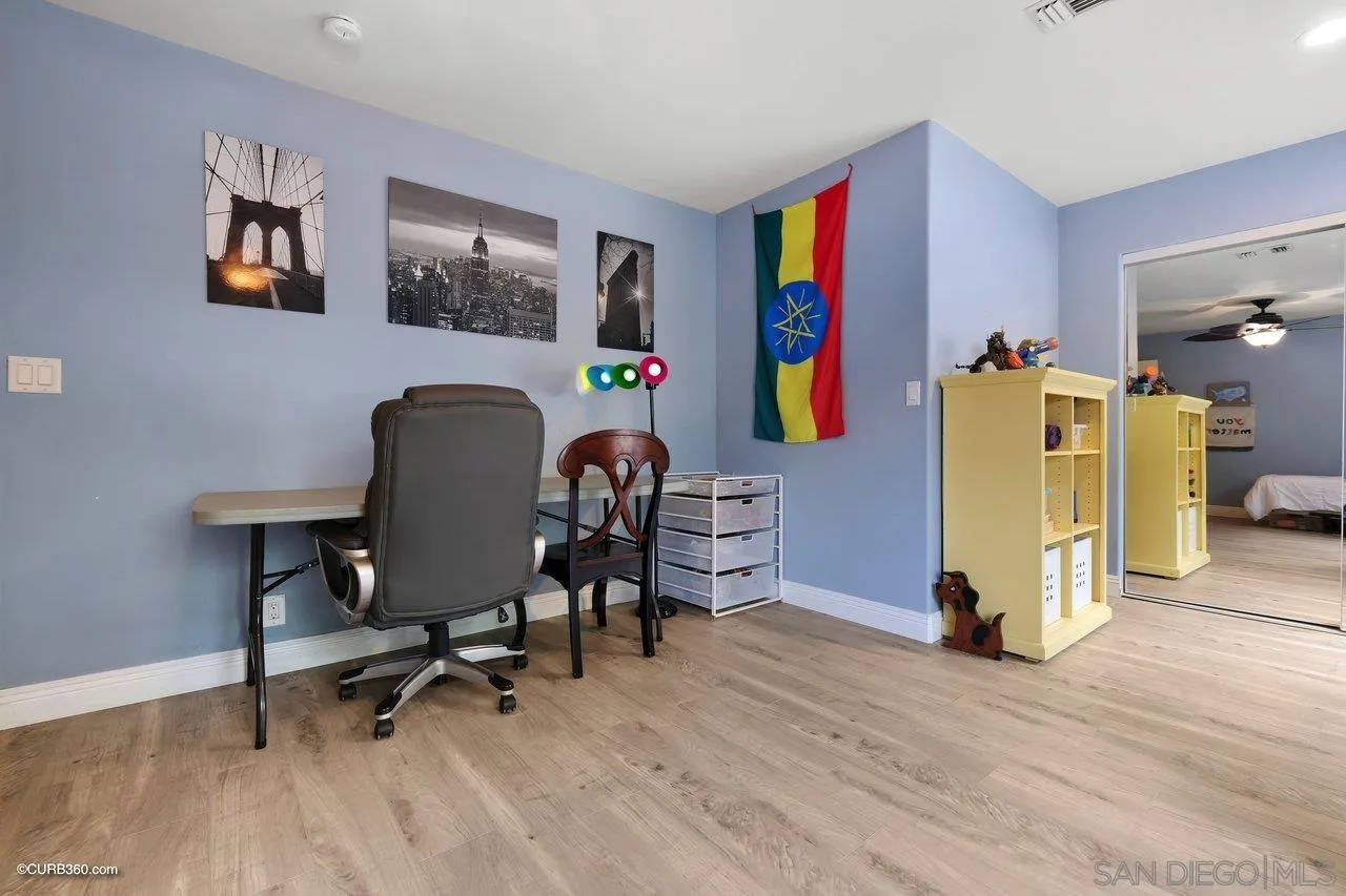 9541 Mandeville Road Santee, CA 92071 - Photo 19 of 32 a workspace with furniture and a wooden floor