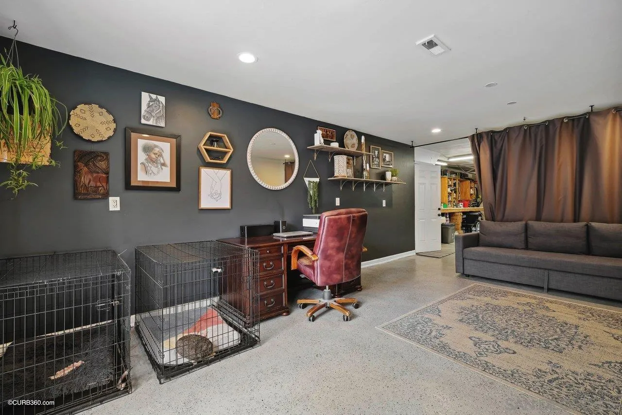 9541 Mandeville Road Santee, CA 92071 - Photo 26 of 32 a living room with furniture a clock on wall and a window