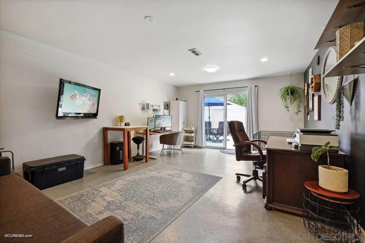 9541 Mandeville Road Santee, CA 92071 - Photo 27 of 32 a living room with furniture a piano and a flat screen tv