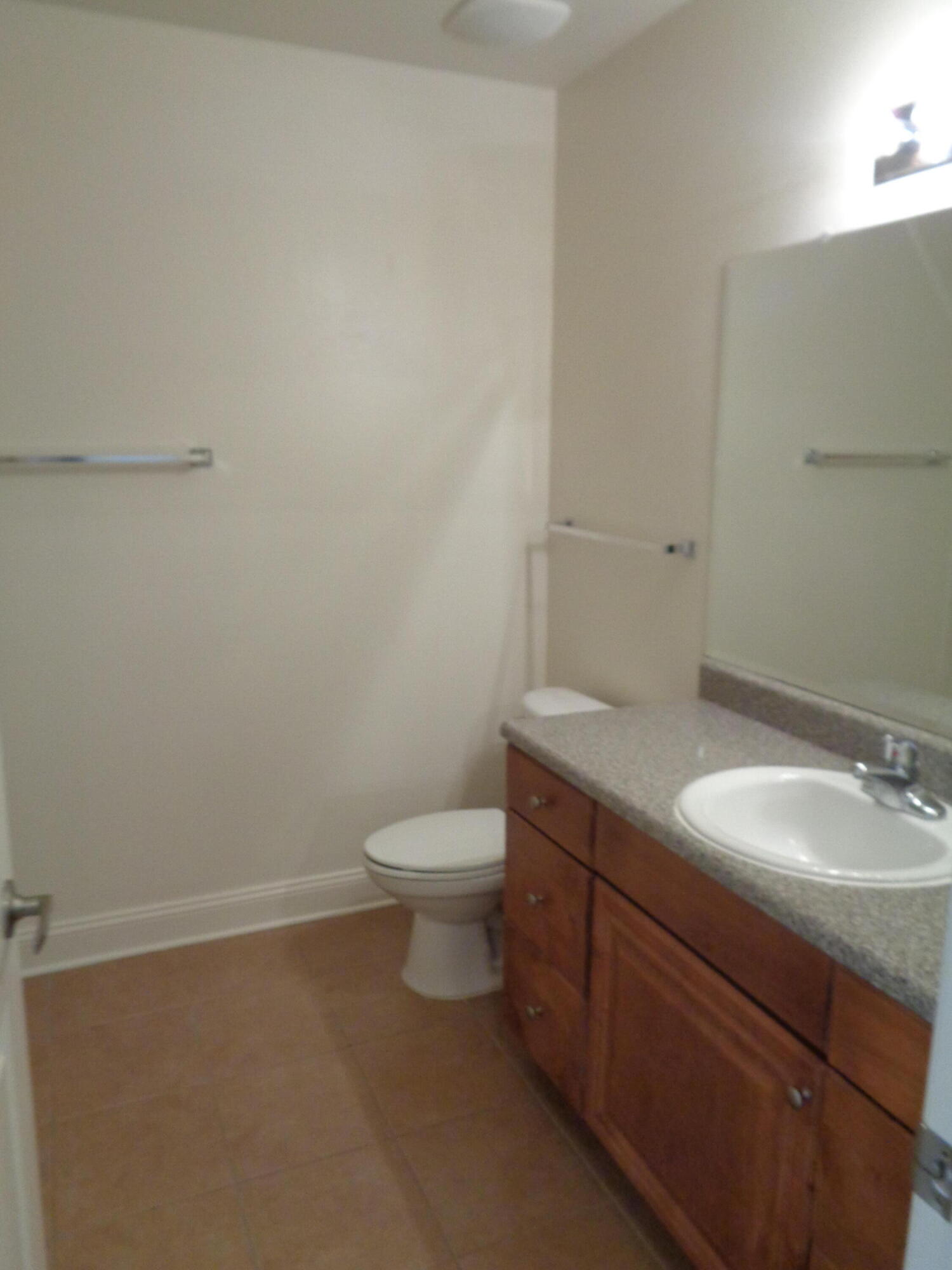555 Wingspan Way Crestview, FL 32536 - Photo 15 of 24 a bathroom with a granite countertop toilet and sink