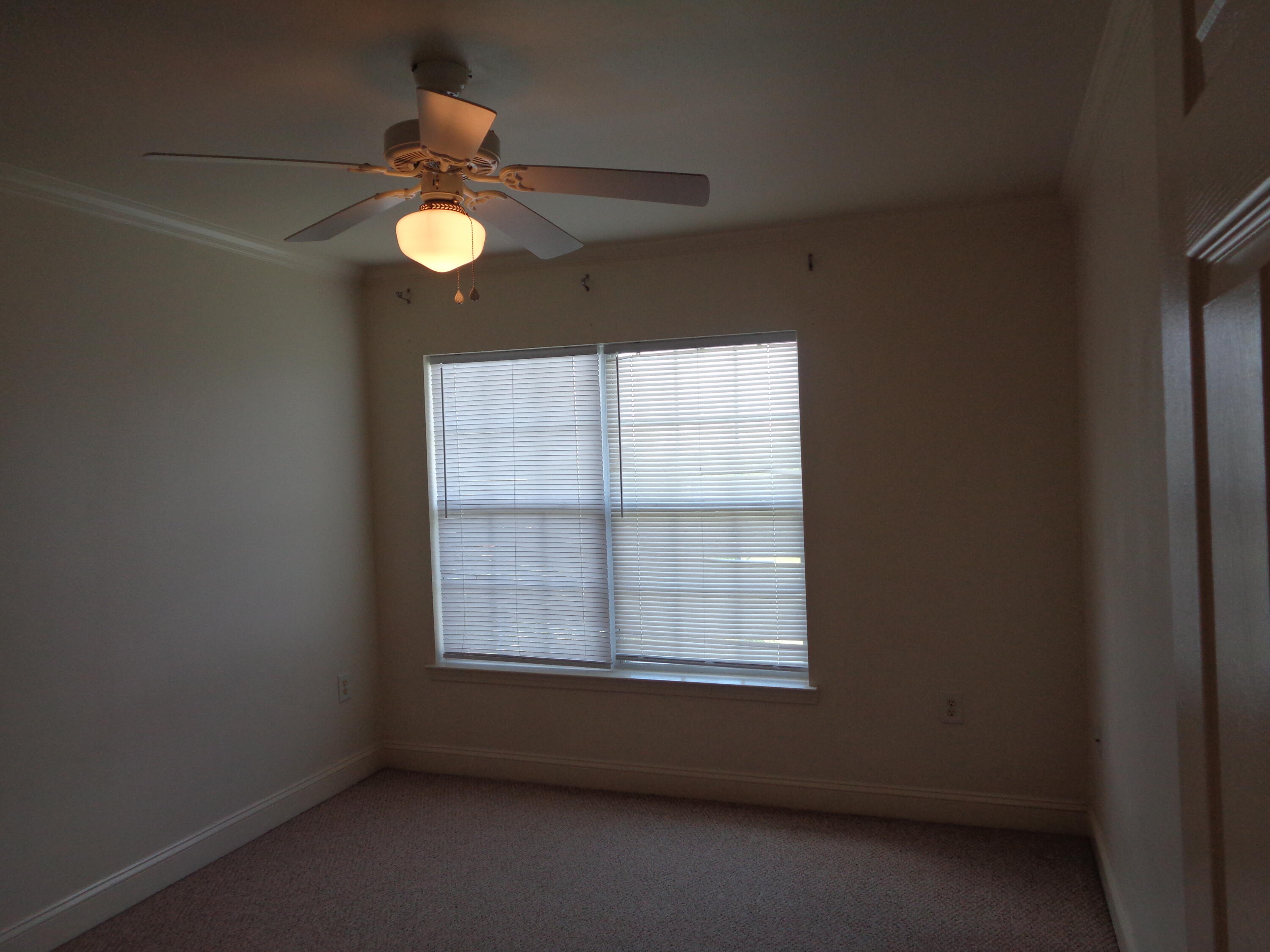 555 Wingspan Way Crestview, FL 32536 - Photo 17 of 24 an empty room with a window