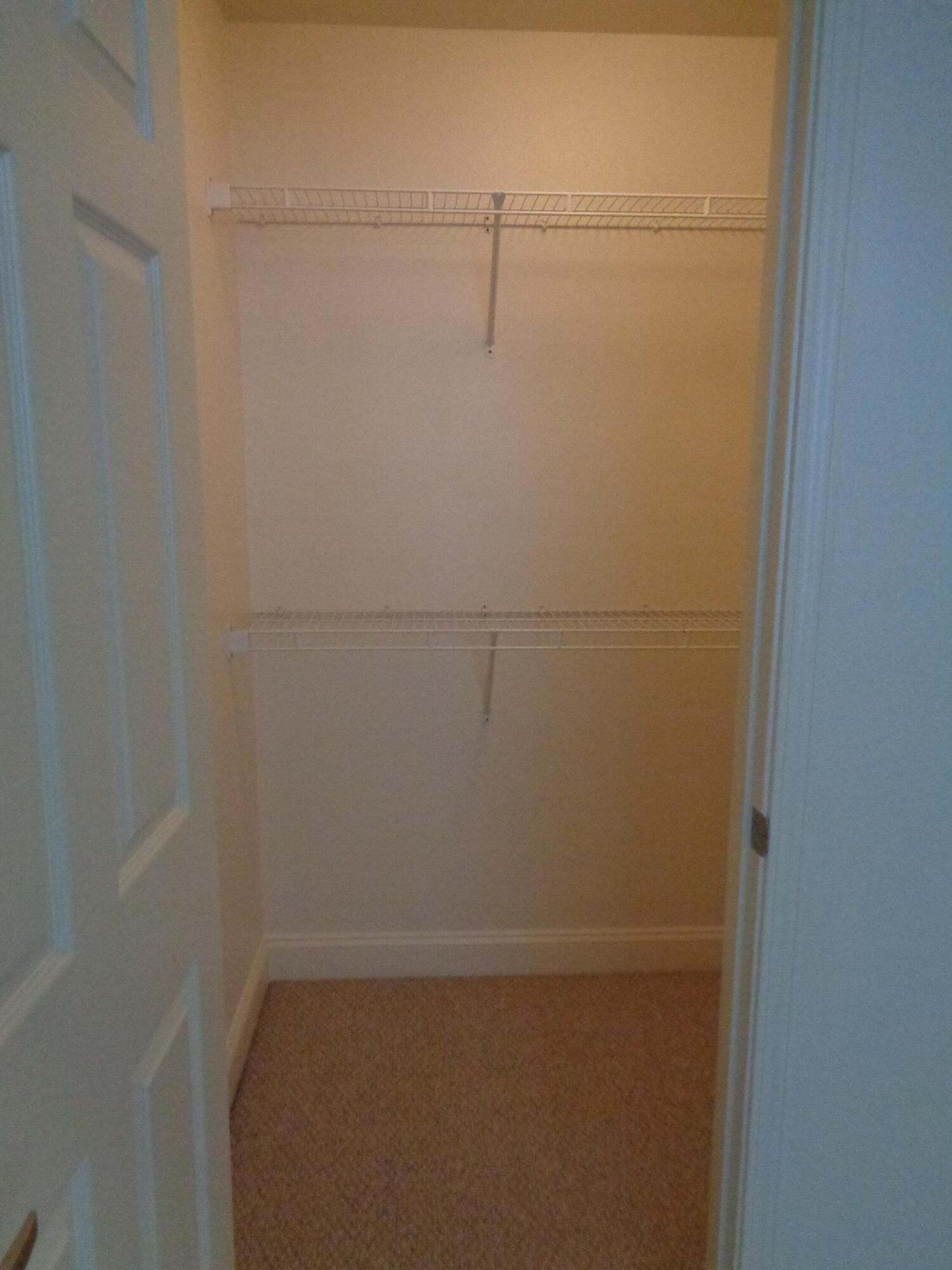 555 Wingspan Way Crestview, FL 32536 - Photo 22 of 24 a view of a room with racks on the wall