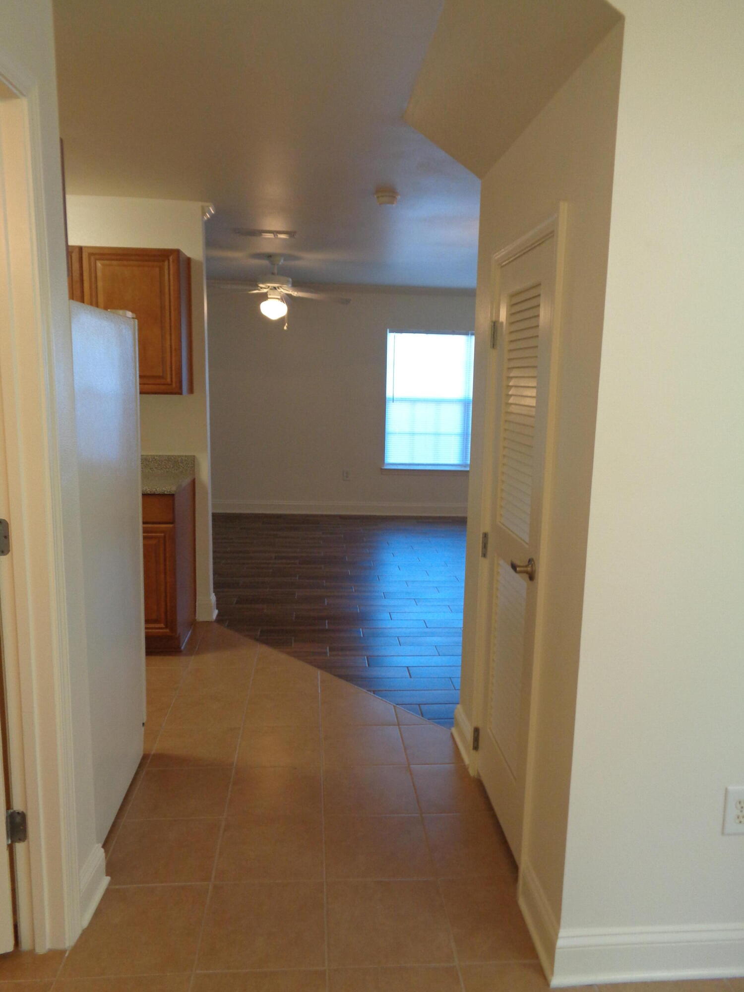 555 Wingspan Way Crestview, FL 32536 - Photo 3 of 24 a view of hallway with wooden floor and a window