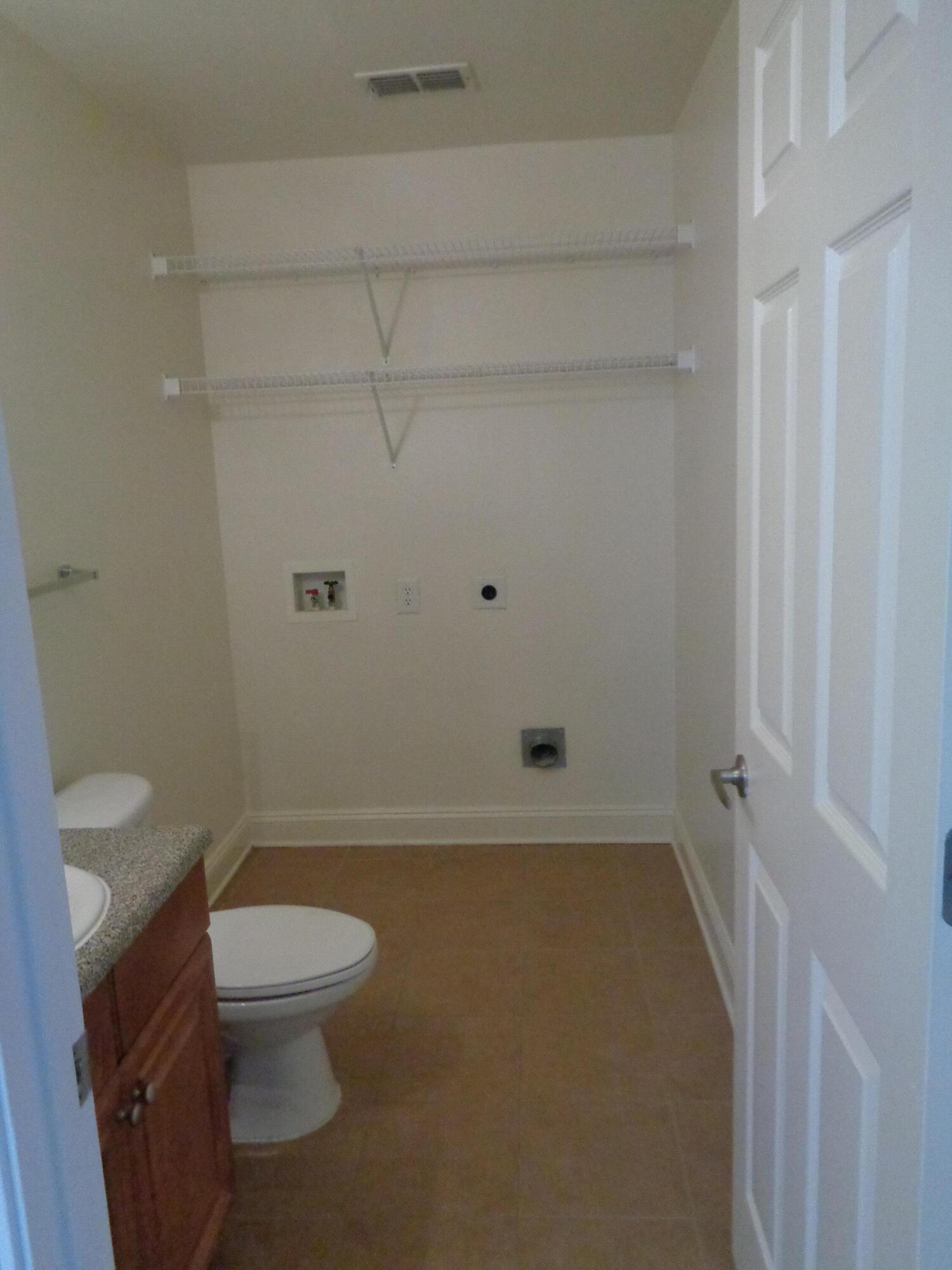 555 Wingspan Way Crestview, FL 32536 - Photo 4 of 24 a bathroom with a toilet and a shower