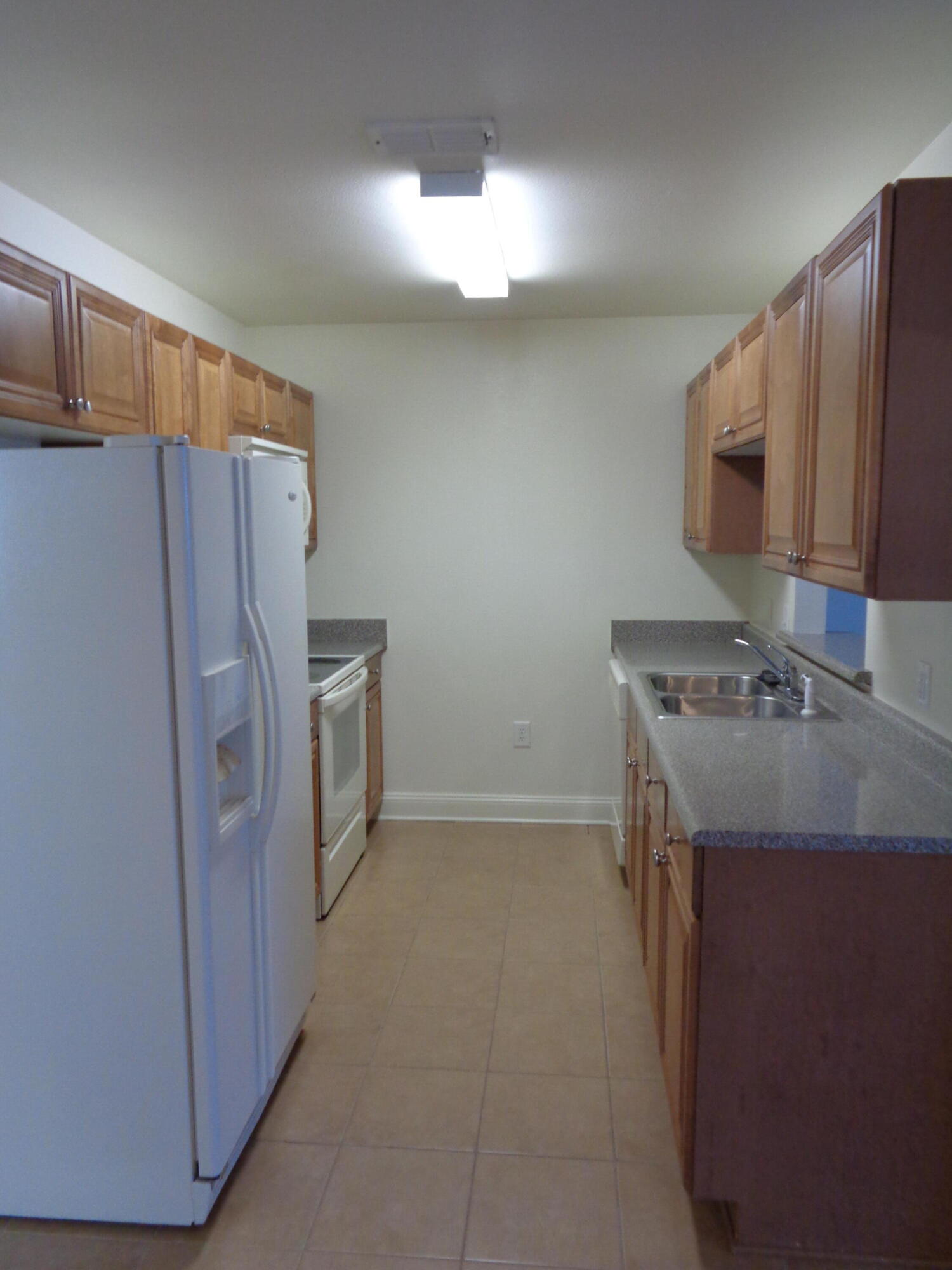 555 Wingspan Way Crestview, FL 32536 - Photo 5 of 24 a kitchen with a refrigerator sink and stove