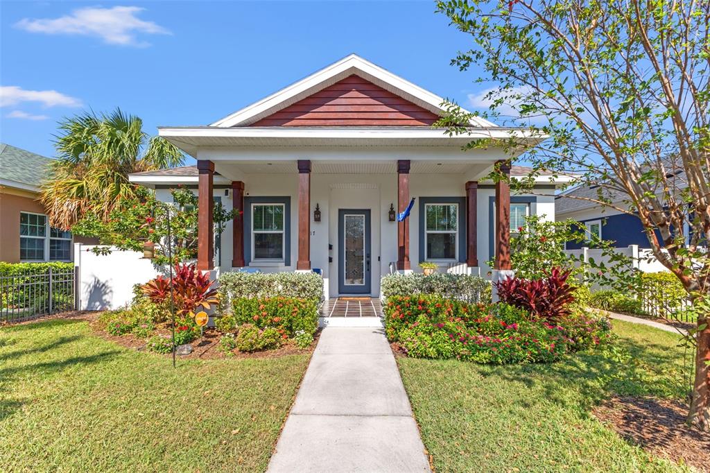 front view of a house with potted plants