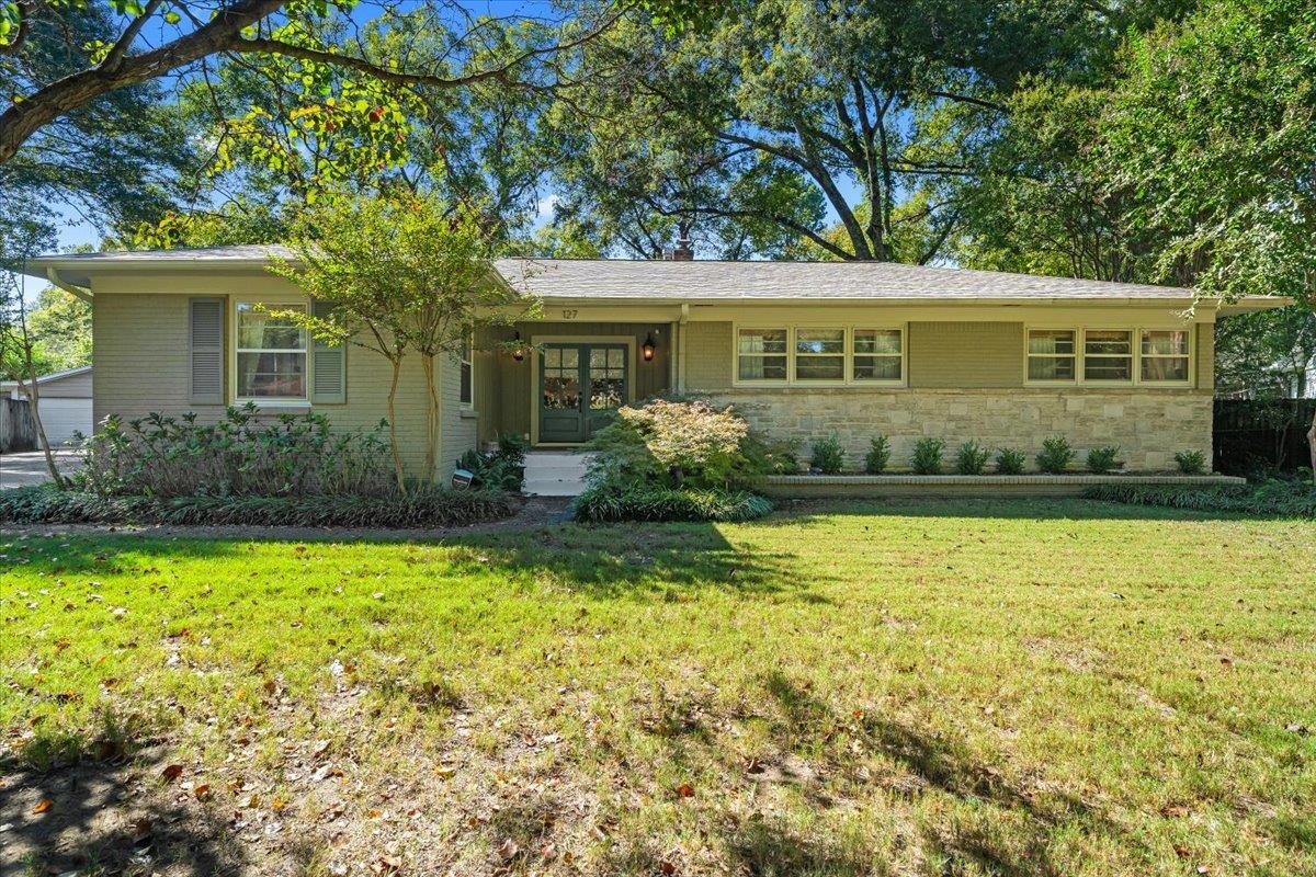 127 North Rose Road Memphis, TN 38117 - Photo 1 of 30 a front view of a house with a garden