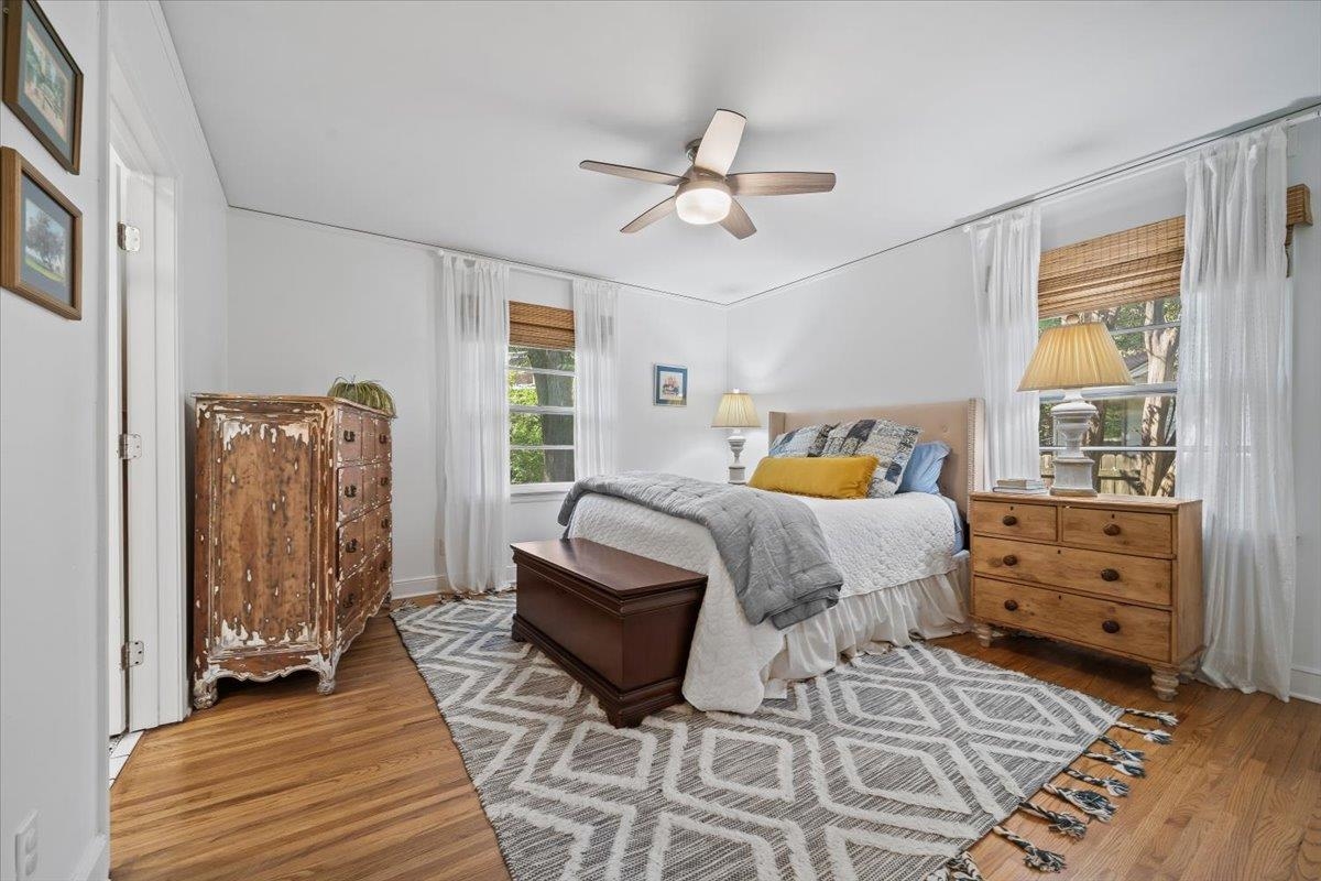 127 North Rose Road Memphis, TN 38117 - Photo 17 of 30 a bedroom with a bed and wooden floor