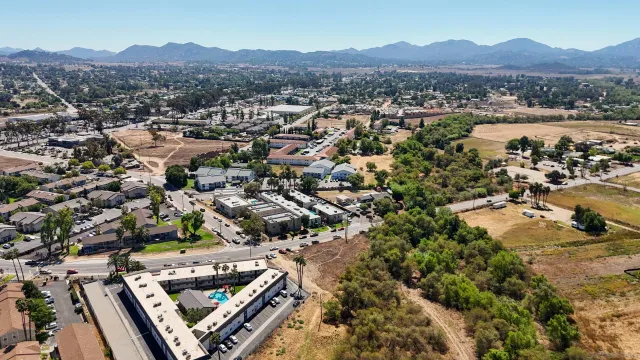 an aerial view of residential houses with outdoor space