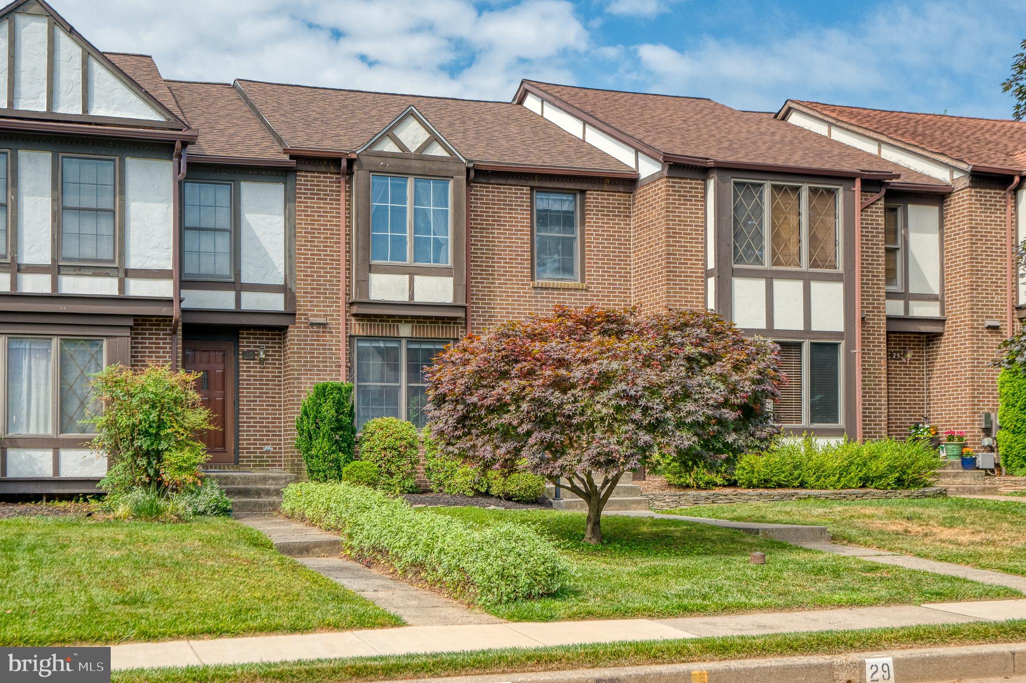 27 Faraday Drive Lutherville-Timonium, MD 21093 - Photo 1 of 60 a front view of a house with garden