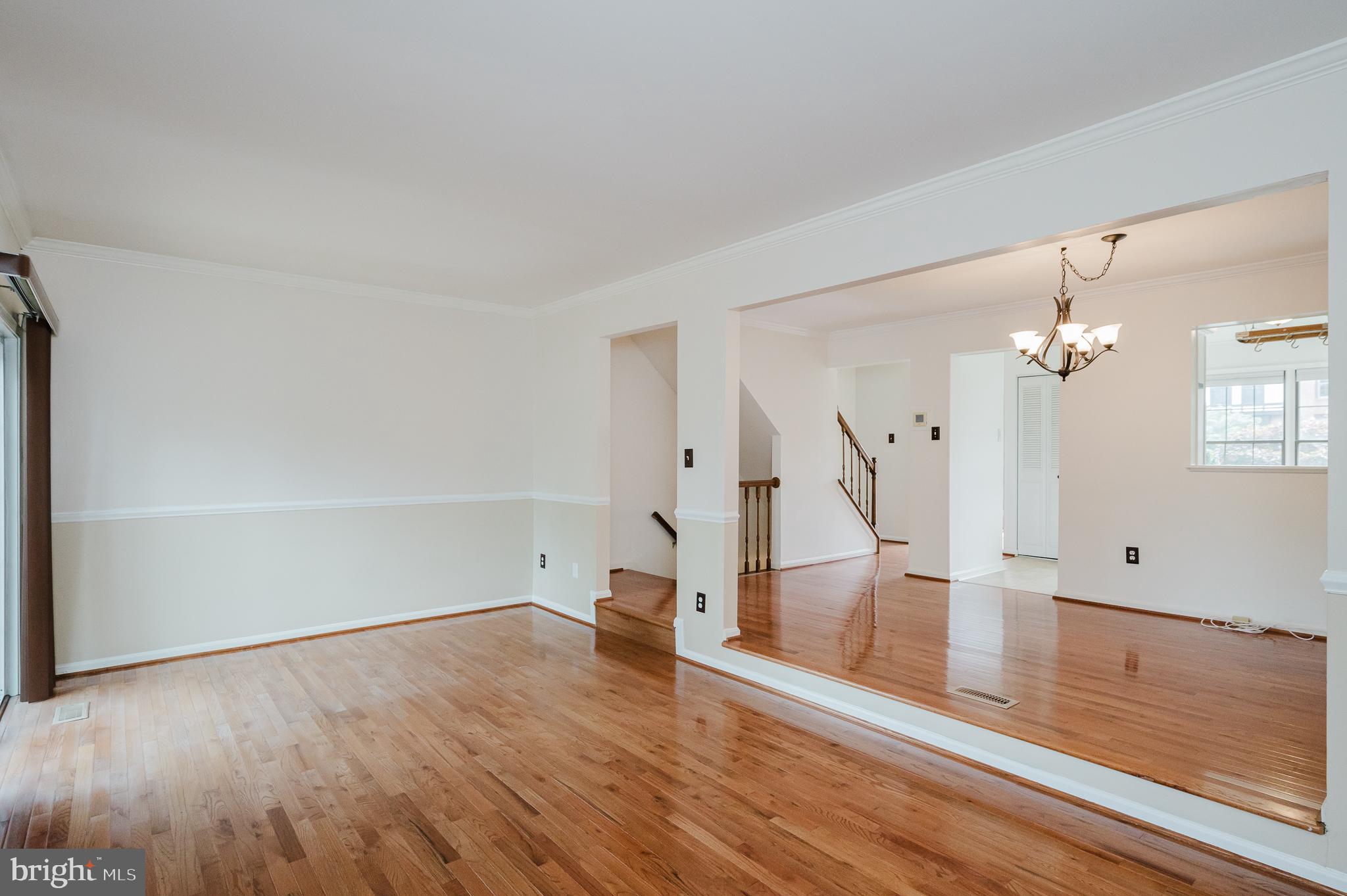 27 Faraday Drive Lutherville-Timonium, MD 21093 - Photo 18 of 60 an empty room with wooden floor and staircase