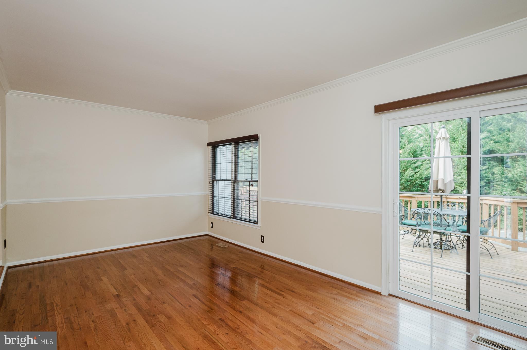 27 Faraday Drive Lutherville-Timonium, MD 21093 - Photo 20 of 60 an empty room with wooden floor and windows