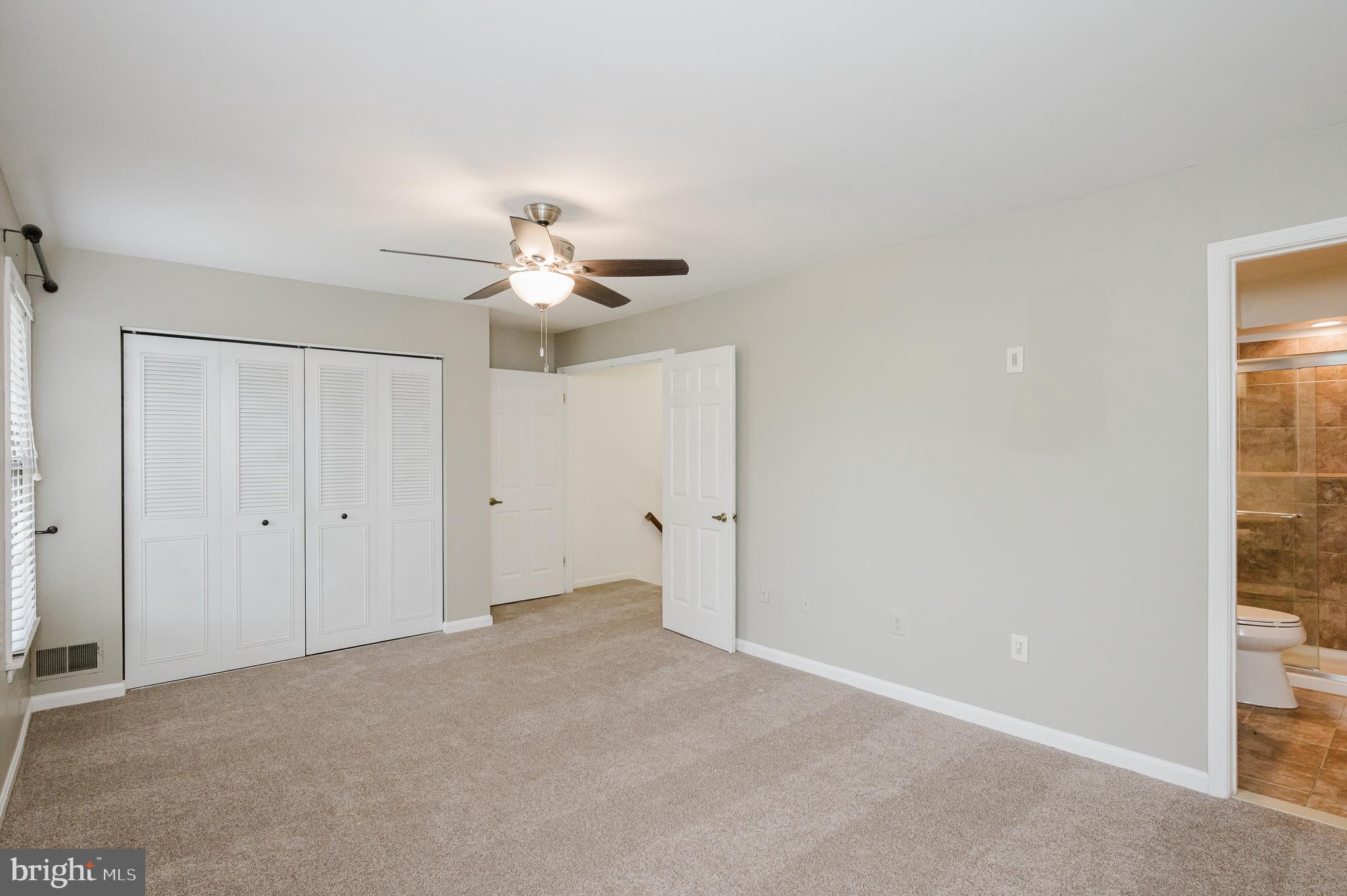 27 Faraday Drive Lutherville-Timonium, MD 21093 - Photo 26 of 60 a view of a room with a ceiling fan and a window