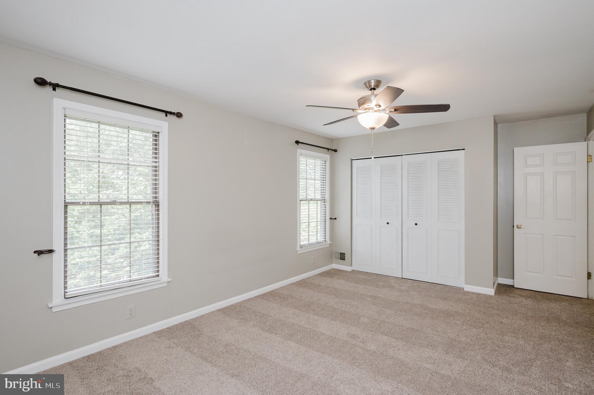 27 Faraday Drive Lutherville-Timonium, MD 21093 - Photo 27 of 60 a view of an empty room with a ceiling fan and a window