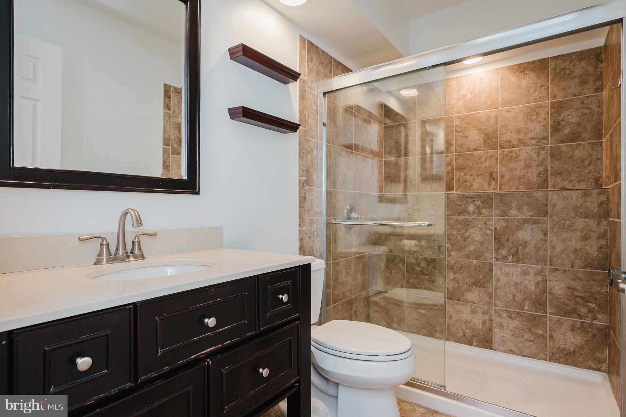 27 Faraday Drive Lutherville-Timonium, MD 21093 - Photo 28 of 60 a bathroom with a sink vanity mirror and toilet