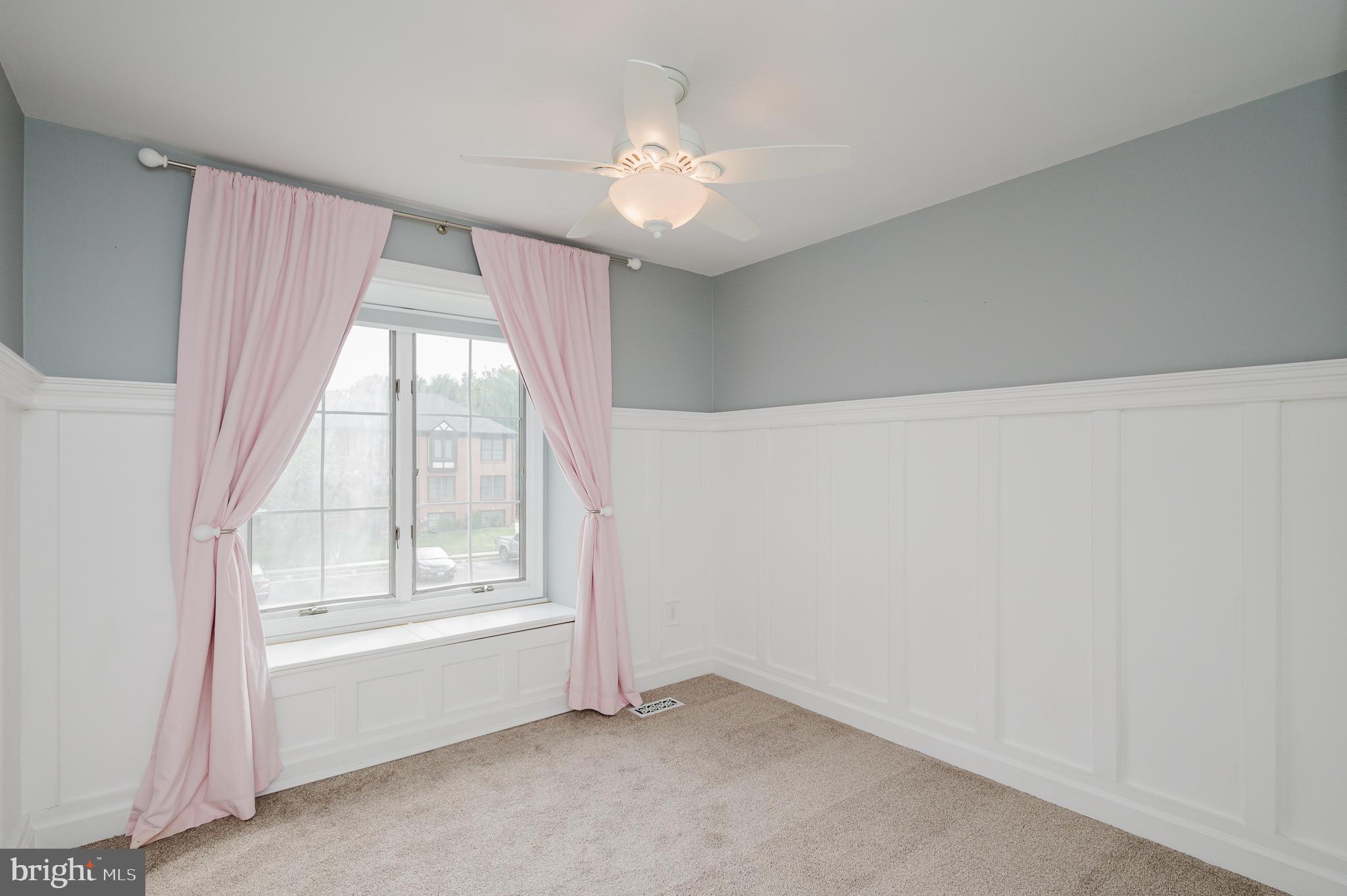 27 Faraday Drive Lutherville-Timonium, MD 21093 - Photo 29 of 60 an empty room with windows and chandelier fan