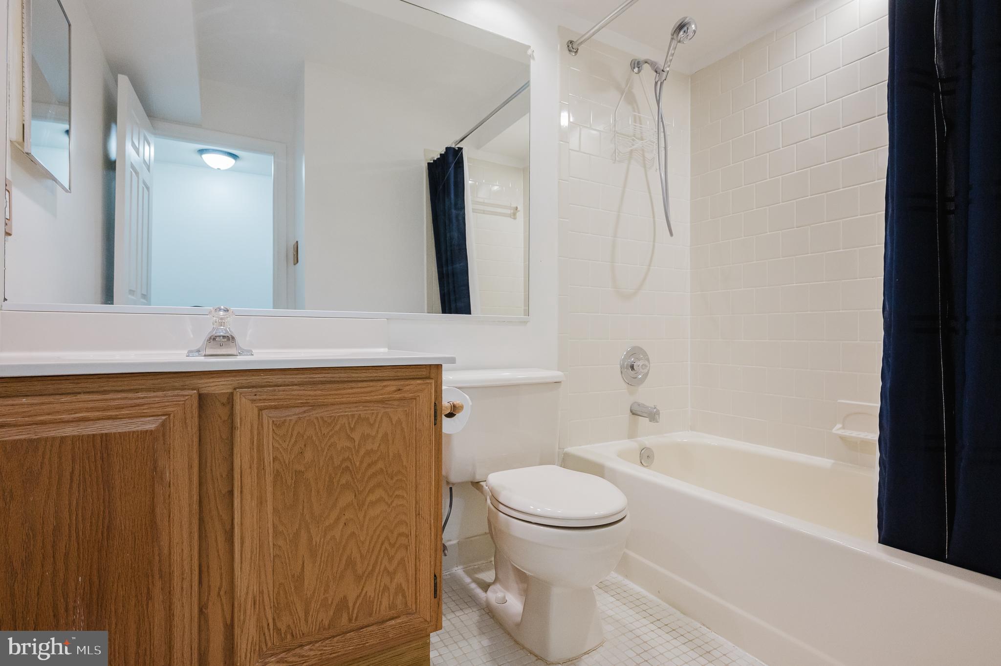 27 Faraday Drive Lutherville-Timonium, MD 21093 - Photo 33 of 60 a bathroom with a sink a toilet and shower