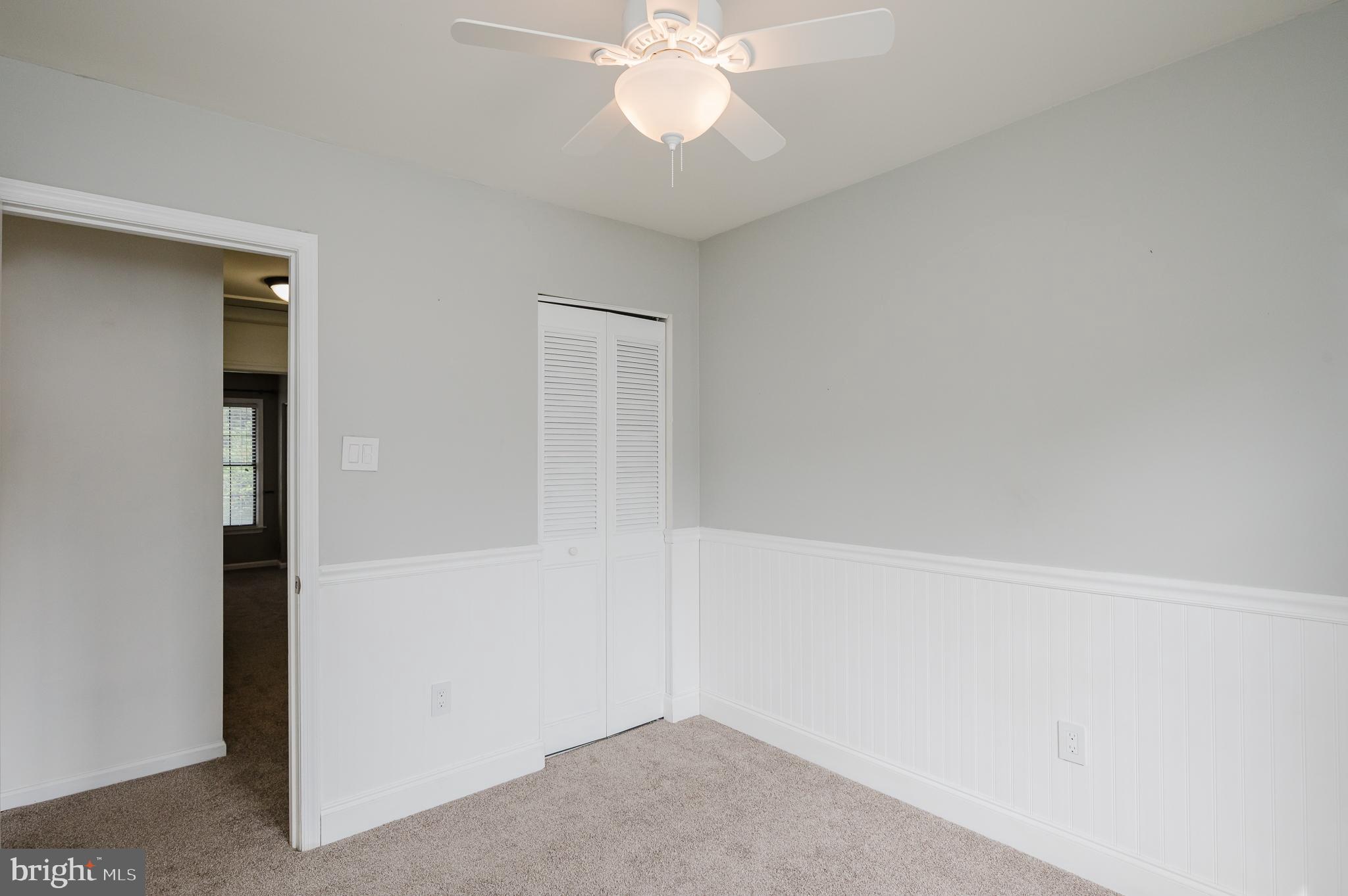 27 Faraday Drive Lutherville-Timonium, MD 21093 - Photo 37 of 60 an empty room with a chandelier fan and closet