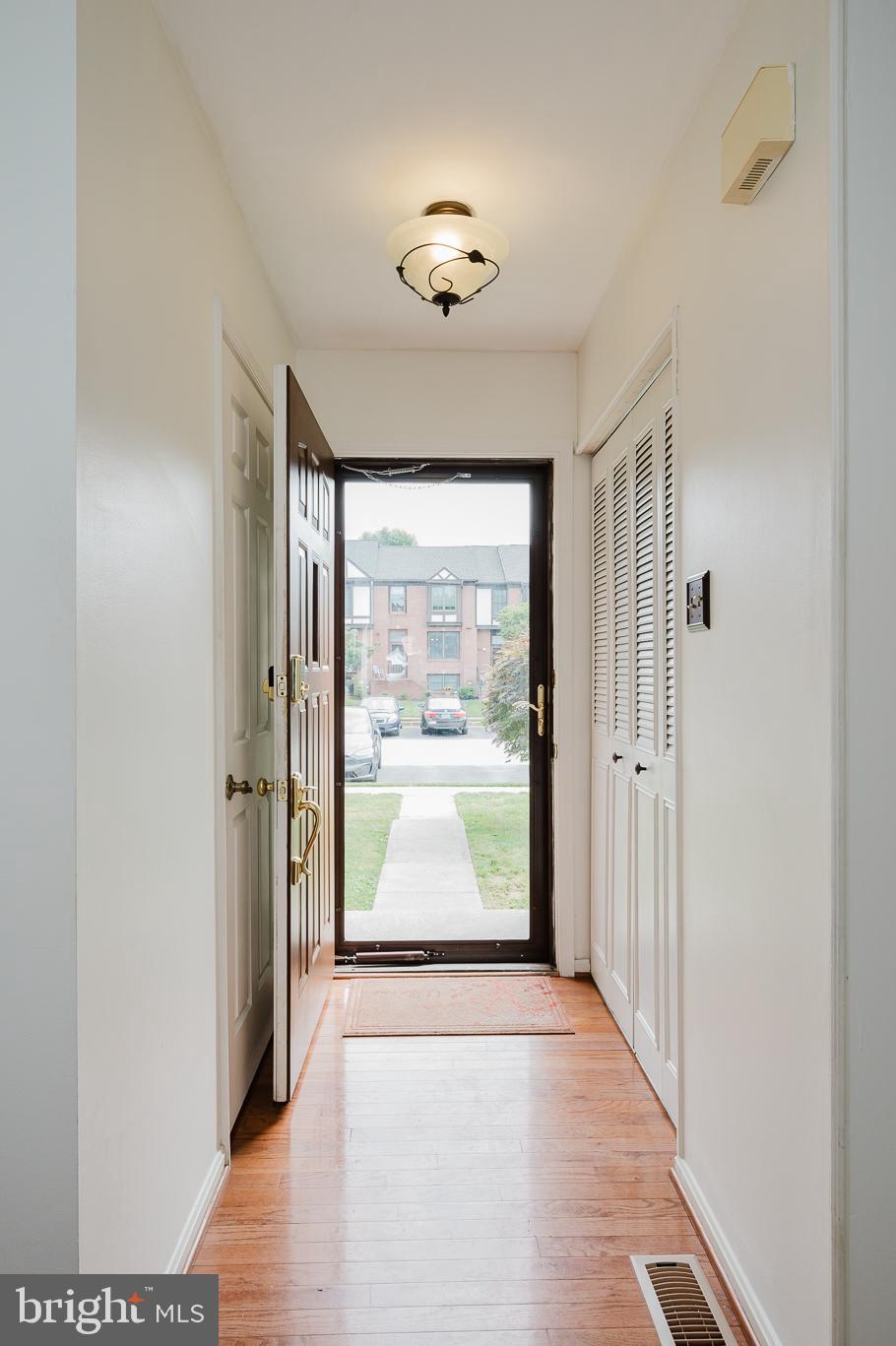 27 Faraday Drive Lutherville-Timonium, MD 21093 - Photo 5 of 60 a view of a hallway with wooden floor and windows