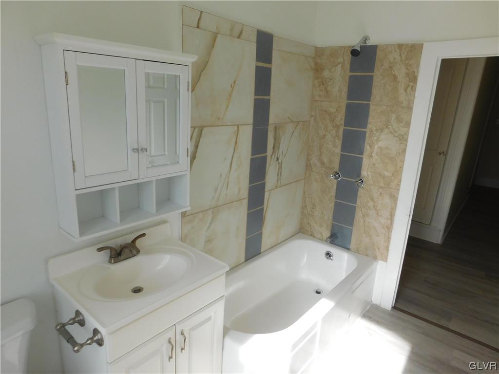 121 Main Street Stockertown, PA 18083 - Photo 21 of 28 a bathroom with a sink and mirror with bathtub