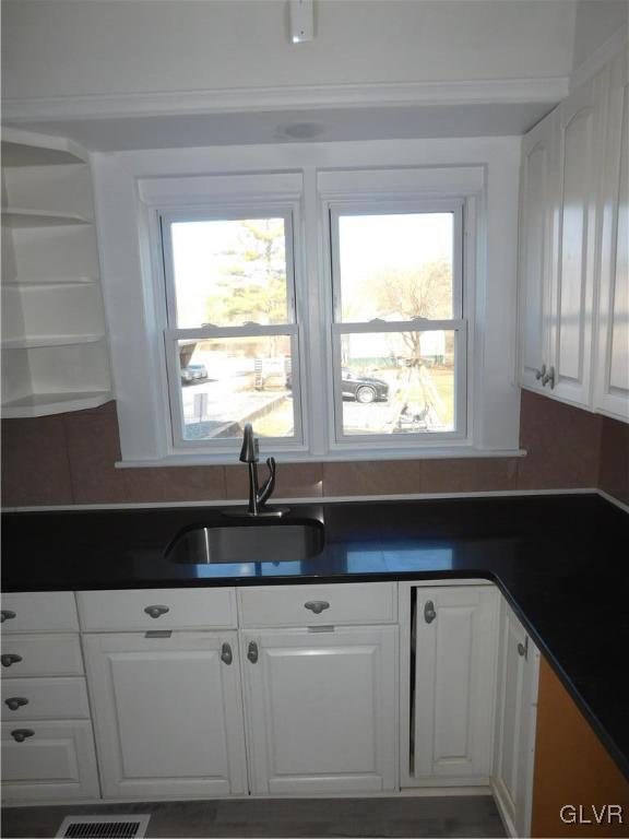 121 Main Street Stockertown, PA 18083 - Photo 8 of 28 a kitchen with granite countertop white cabinets white appliances and a large window