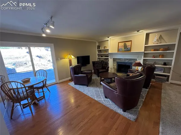 a bedroom with a bed a chandelier and window