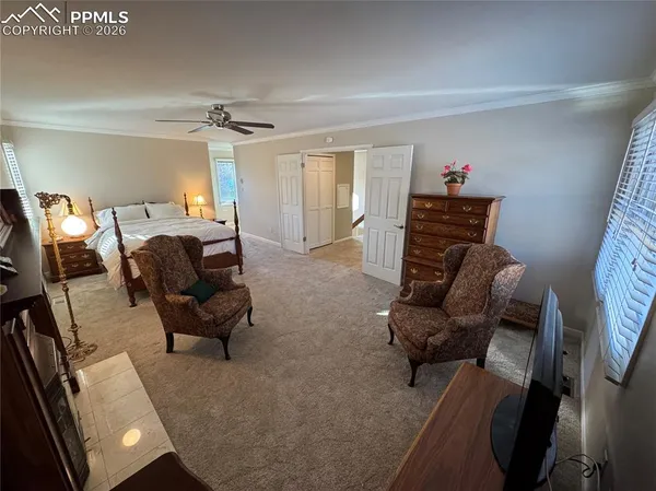 a room with wooden floor and furniture