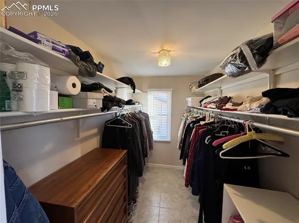 a view of a house with a yard and flowers