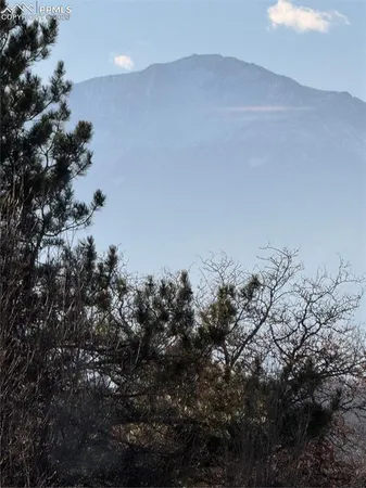 a view of a street with cars
