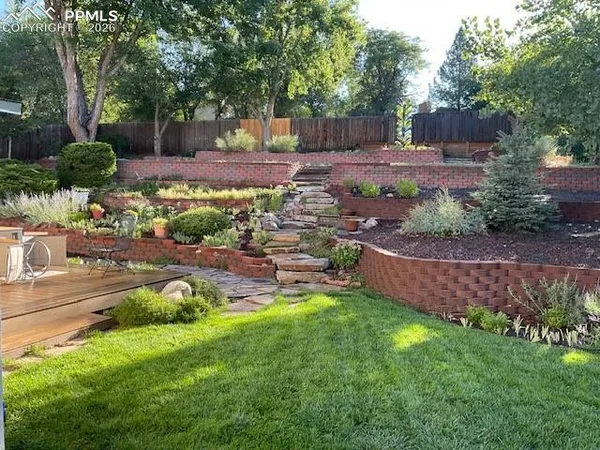 a living room with furniture wooden floor and white walls