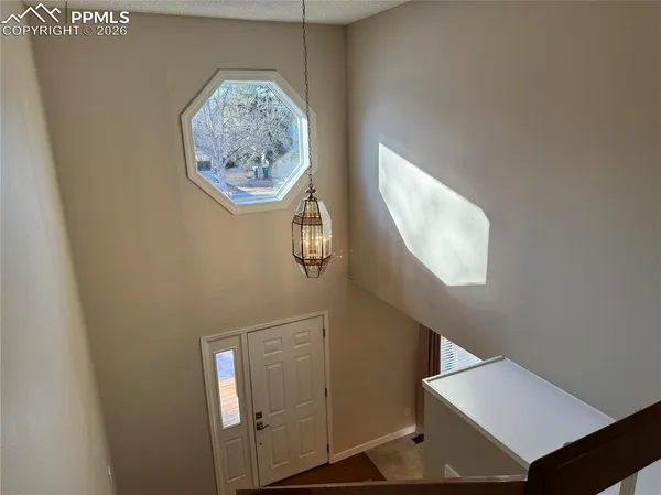 a kitchen with stainless steel appliances a refrigerator and a stove top oven