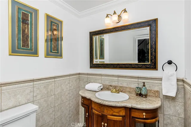 a bedroom with a bed dresser and a chair