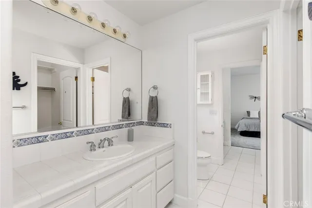 a spacious bedroom with a large bed and a large window