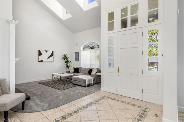 a kitchen with stainless steel appliances granite countertop a table and chairs in it