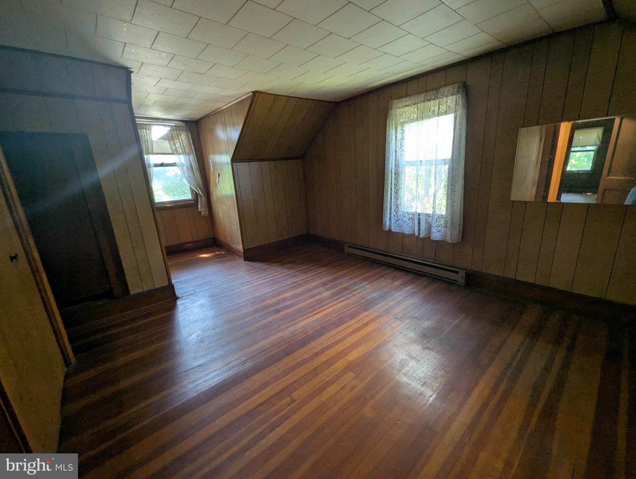 2215 Ady Road Forest Hill, MD 21050 - Photo 19 of 23 a view of an empty room with wooden floor and windows