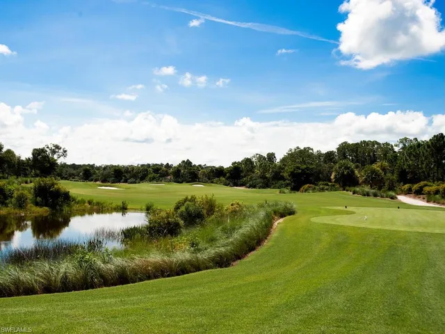 a view of a golf course with a lake