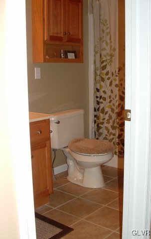 4145 Walter Road Bethlehem, PA 18020 - Photo 11 of 11 a white toilet sitting next to a shower curtain