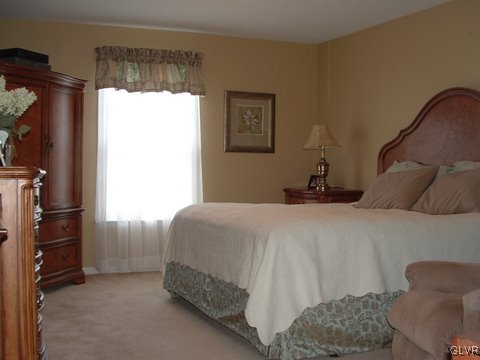4145 Walter Road Bethlehem, PA 18020 - Photo 9 of 11 a bedroom with a bed window and a chair