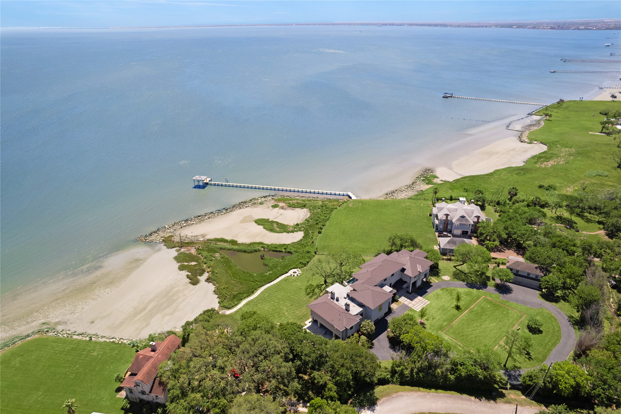 633 Quintana Roo Place Seabrook, TX 77586 - Photo 2 of 47 The expansive 2+ acre property, with its own private beach and coastal pond, is even more impressive in person!