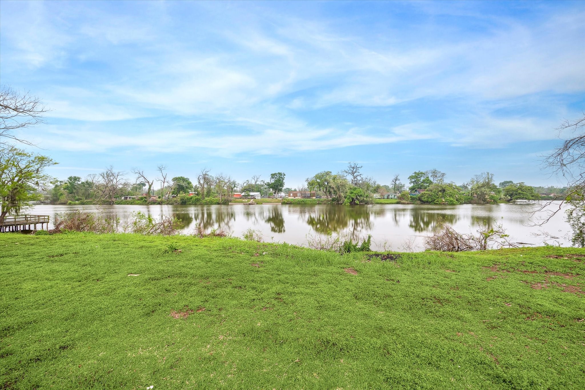 201 Smiley Road Angleton, TX 77515 - Photo 2 of 10 a view of a lake with houses in the background