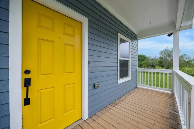 a view of a balcony with wooden floor