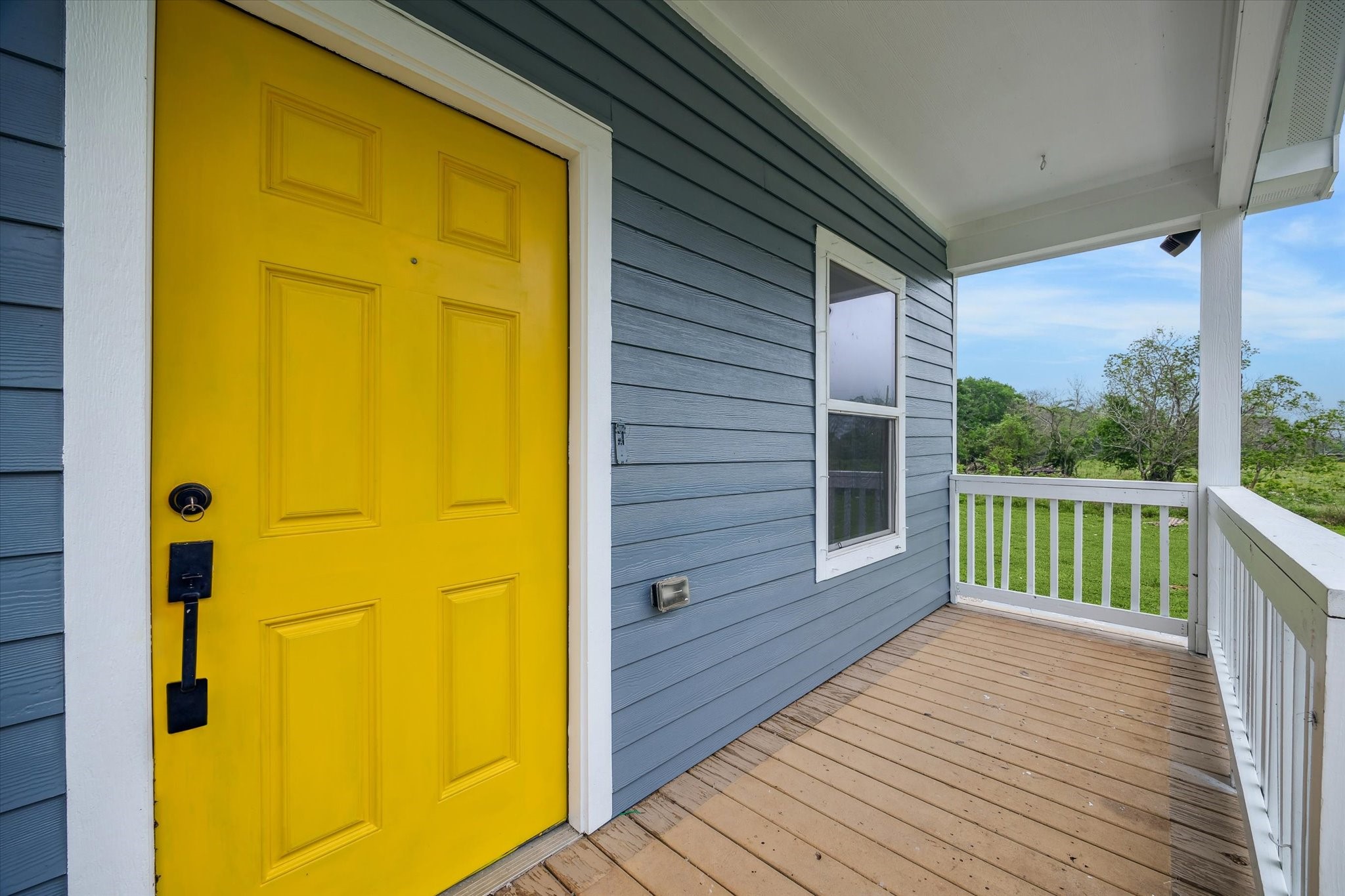 201 Smiley Road Angleton, TX 77515 - Photo 3 of 10 a view of a balcony with wooden floor